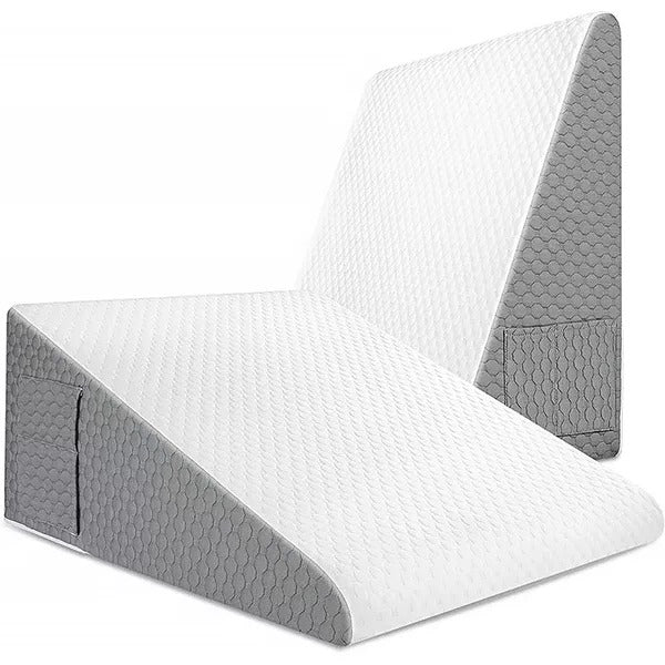 Belro Triangle Memory Foam Wedge Pillow for sleeping, supports neck and back, in a neutral color on a bed.