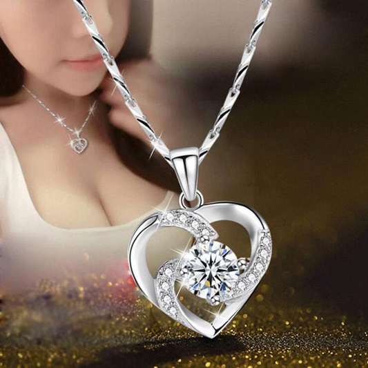 Sterling silver crystal heart necklace with CZ pendant, elegant jewelry accessory featuring Belro branding.