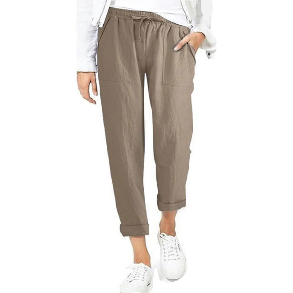 Belro summer trousers in lightweight fabric, shown in beige with a relaxed fit and side pockets, perfect for casual warm-weather wear.