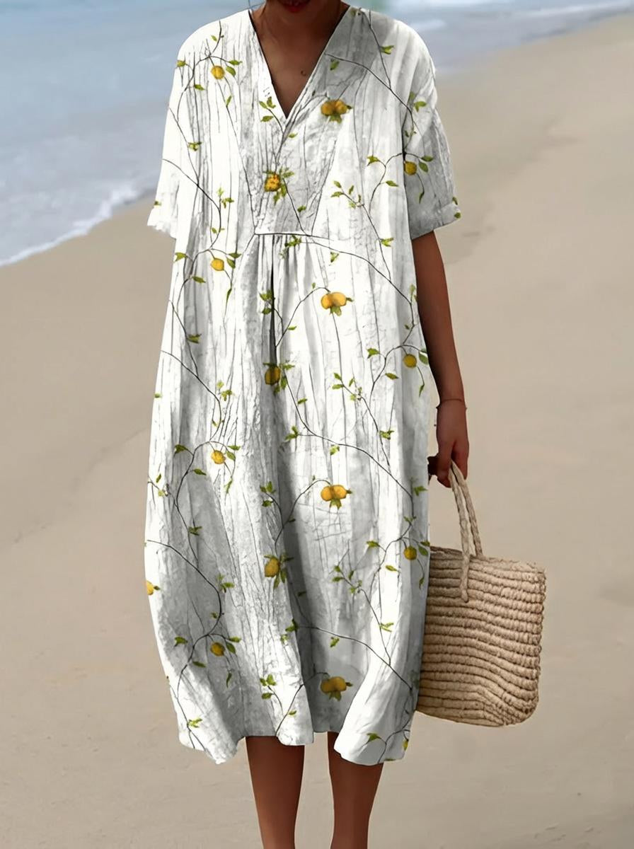 Belro summer dress featuring a flowy fabric, floral pattern, and sleeveless design, perfect for warm weather and casual outings.