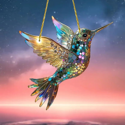 Colorful hummingbird suncatcher hanging in a window, decorative glass home decor piece by Belro.