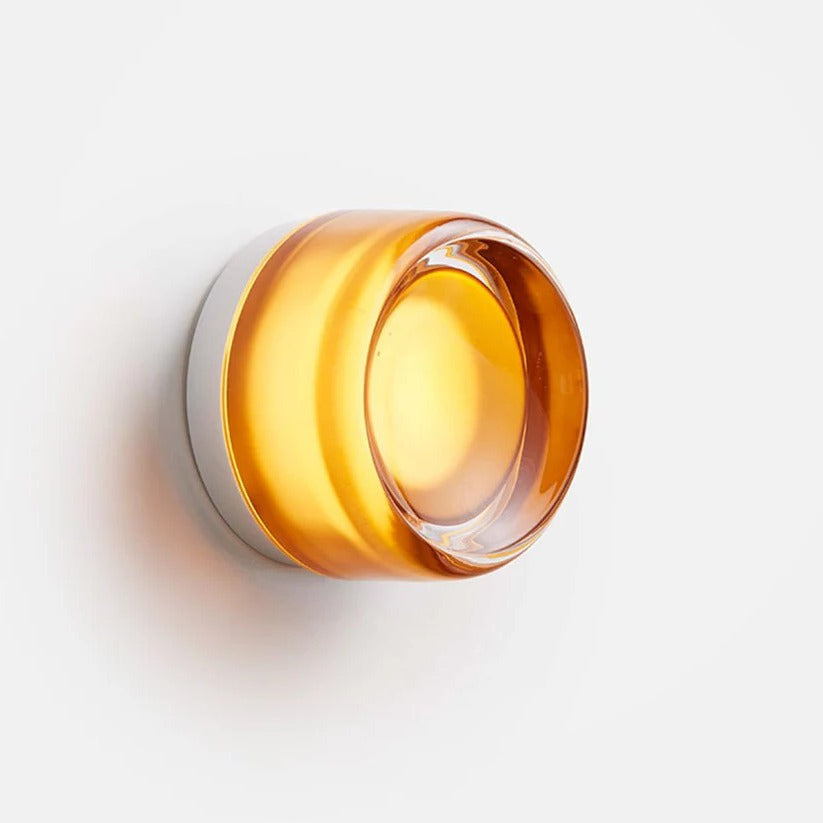 Modern dimple glass LED wall sconce by Belro, outdoor lighting fixture with a sleek design and illuminated dimpled glass shade.