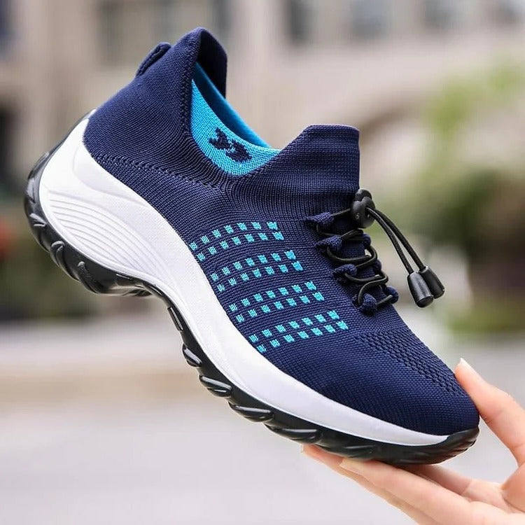 Belro orthopaedic sneakers in gray with supportive soles and breathable mesh upper, designed for comfortable foot support.