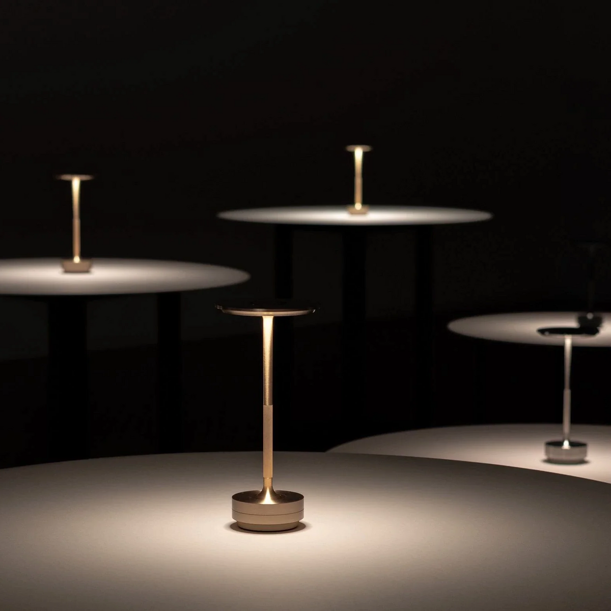 Belro Bailey table lamp with modern design, black finish, and adjustable arm, ideal for desk or workspace lighting.