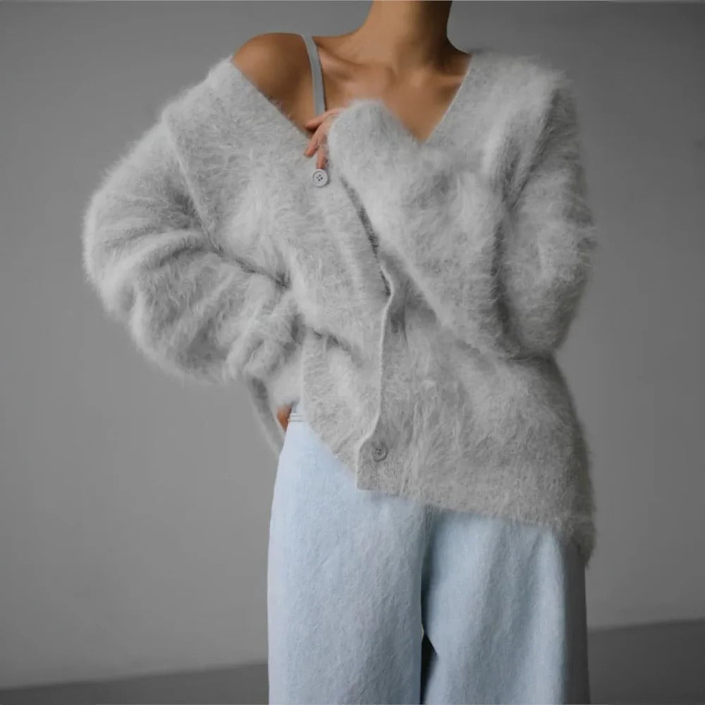 Belro women's soft cashmere sweater, cozy and stylish, featuring a classic knit design in a neutral color.