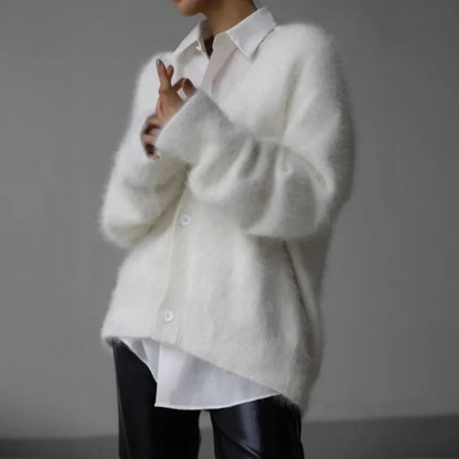 Soft Belro cashmere sweater for women, cozy and high-quality, in a classic style, displayed on a neutral background.