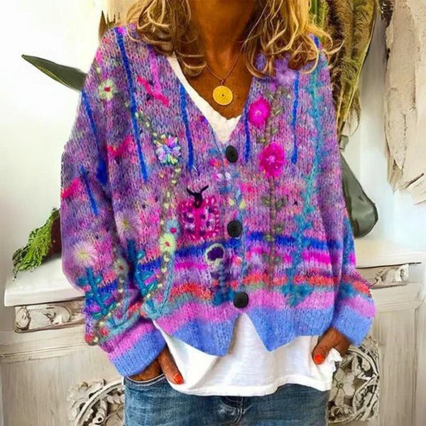 Automotive-themed Belro ladies' sweater featuring floral patterns, displayed with detailed fabric and vibrant floral design.