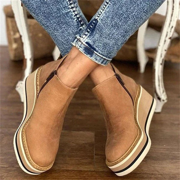 Belro women's low ankle boots with sleek leather design and rounded toe, stylish footwear for casual or dressy occasions.