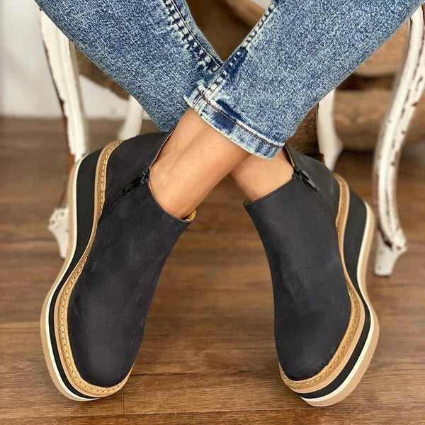 Belro women's low ankle boots in black leather with a sleek, stylish design and low heel for casual and everyday wear.