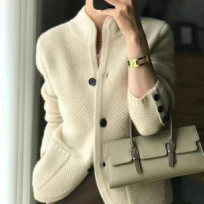 Belro thick wool sweater jacket for cold winter weather, shown on a hanger with a cozy, textured knit design.