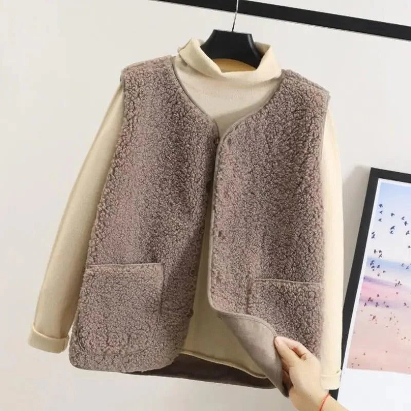 Belro women's wool jacket, stylish and cozy, shown on a hanger with a neutral background, highlighting the textured fabric and classic design.