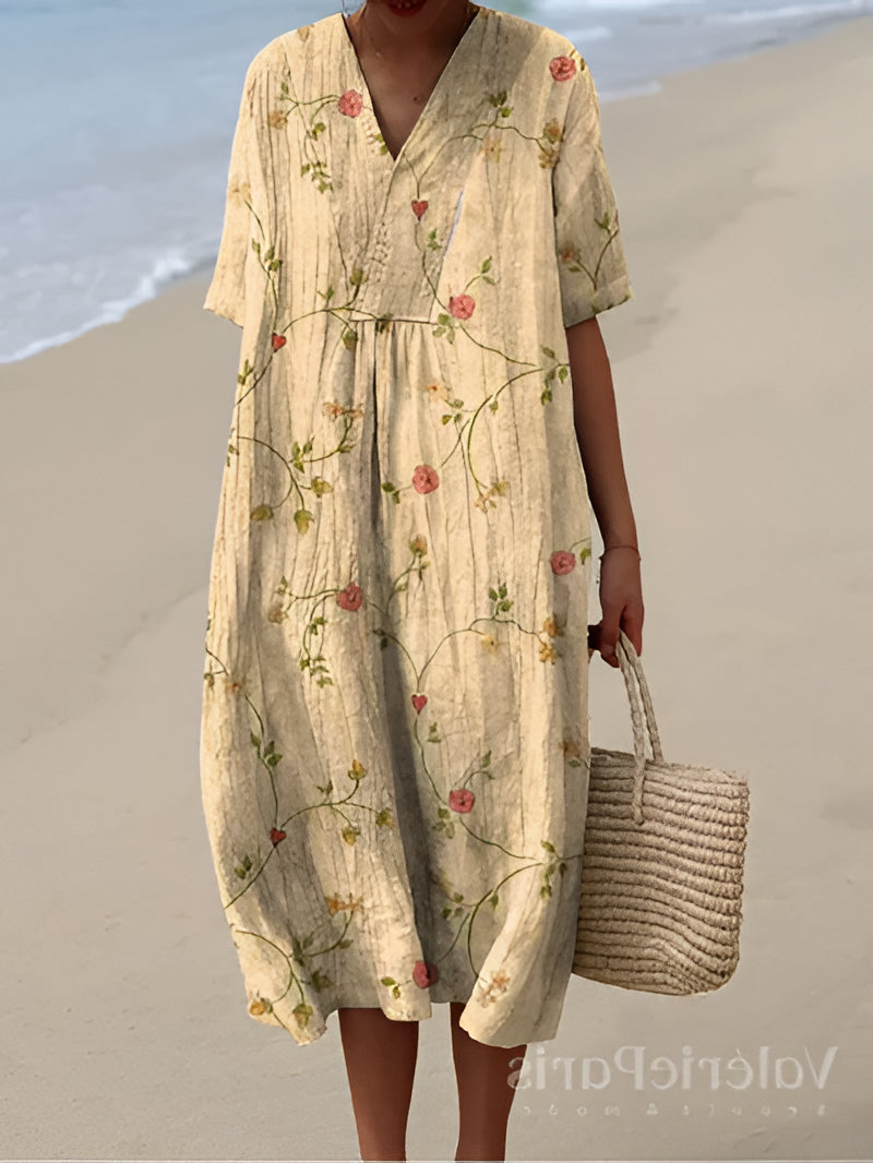 Belro summer dress featuring a flowy fabric, sleeveless design, and vibrant floral pattern for warm weather wear.
