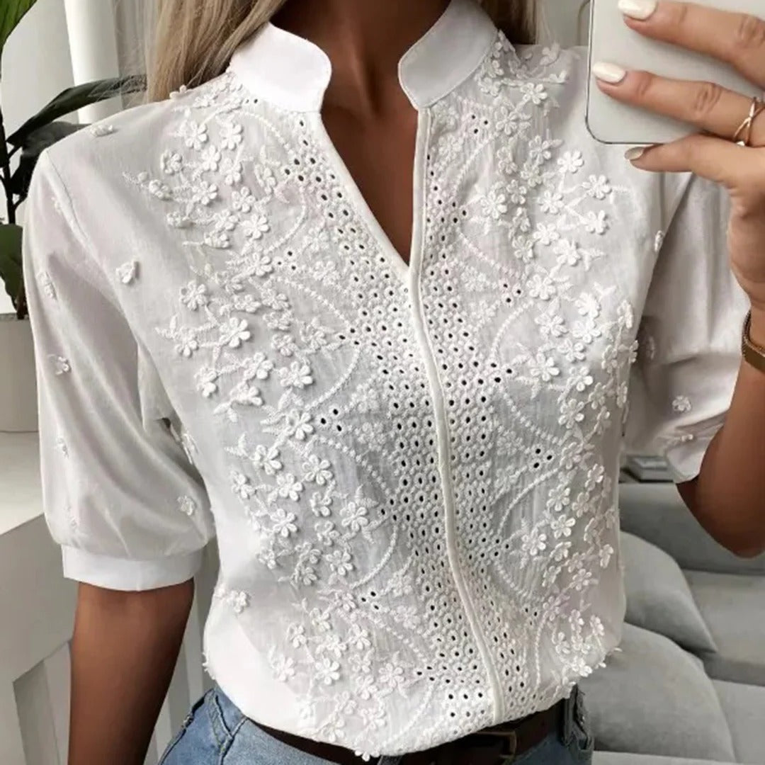Belro fashionable blouse, stylish women's top with a relaxed fit and soft fabric, shown on a hanger.