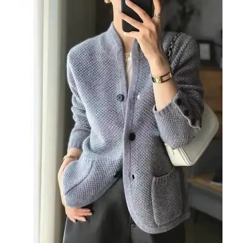Belro thick wool sweater jacket for cold winter weather, shown in a cozy, warm fit with a high collar and textured knit fabric.