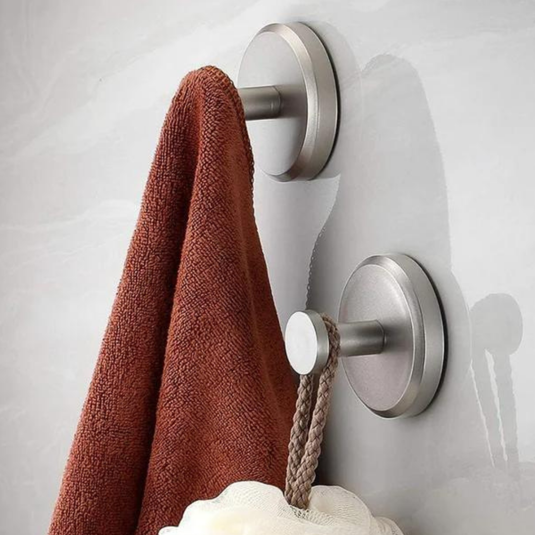 Belro Instant Grip Suction Hooks attached to a bathroom tile for secure, reusable wall organization in home and garden storage.