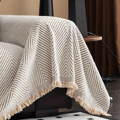 Belro Stripe Herringbone Couch Cover on a sofa, showcasing its stylish woven fabric design and tailored fit for home decor.