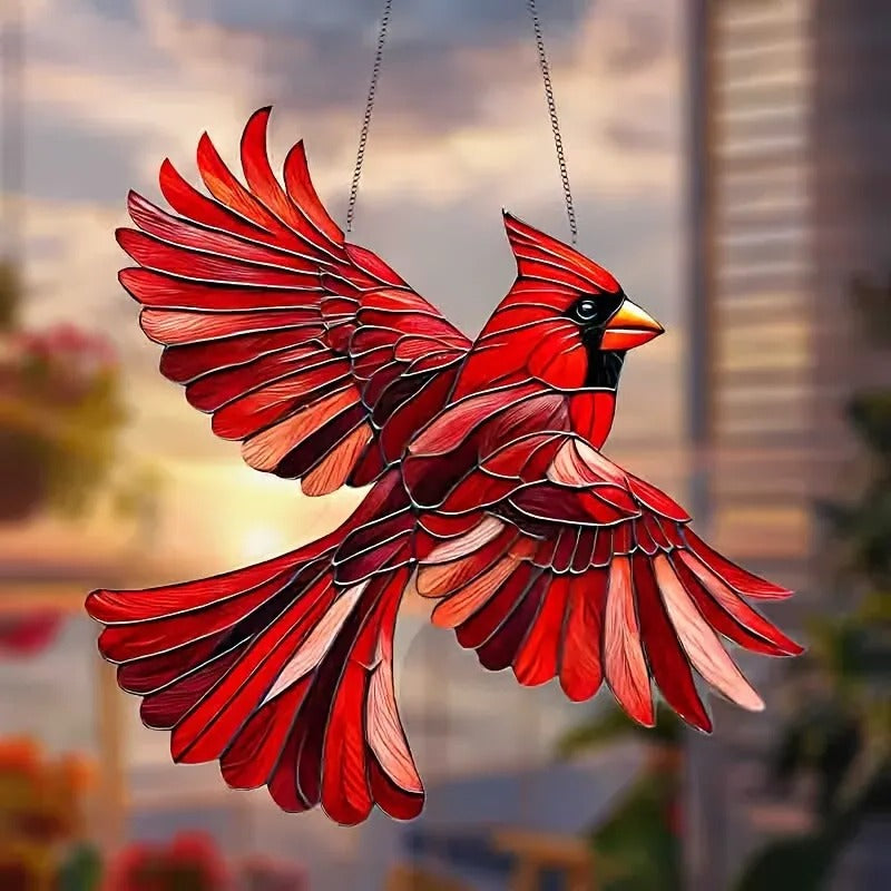 Colorful hummingbird suncatcher hanging in a window, showcasing vibrant glass wings and detailed design from Belro for home decor.