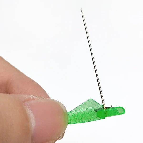 Belro Easy Threader Fish Type sewing machine needle threader for men's clothing, showing the compact tool in a close-up shot.