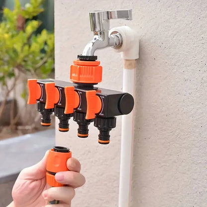 Belro 4-way garden hose splitter attached to a garden hose, with four outlets for watering multiple garden areas.