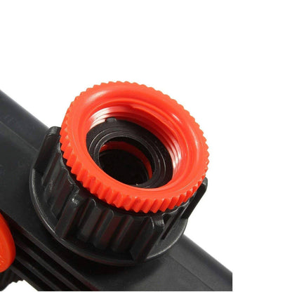 Belro 4-way garden hose splitter connected to garden hoses, allowing multiple watering outlets for outdoor gardening.