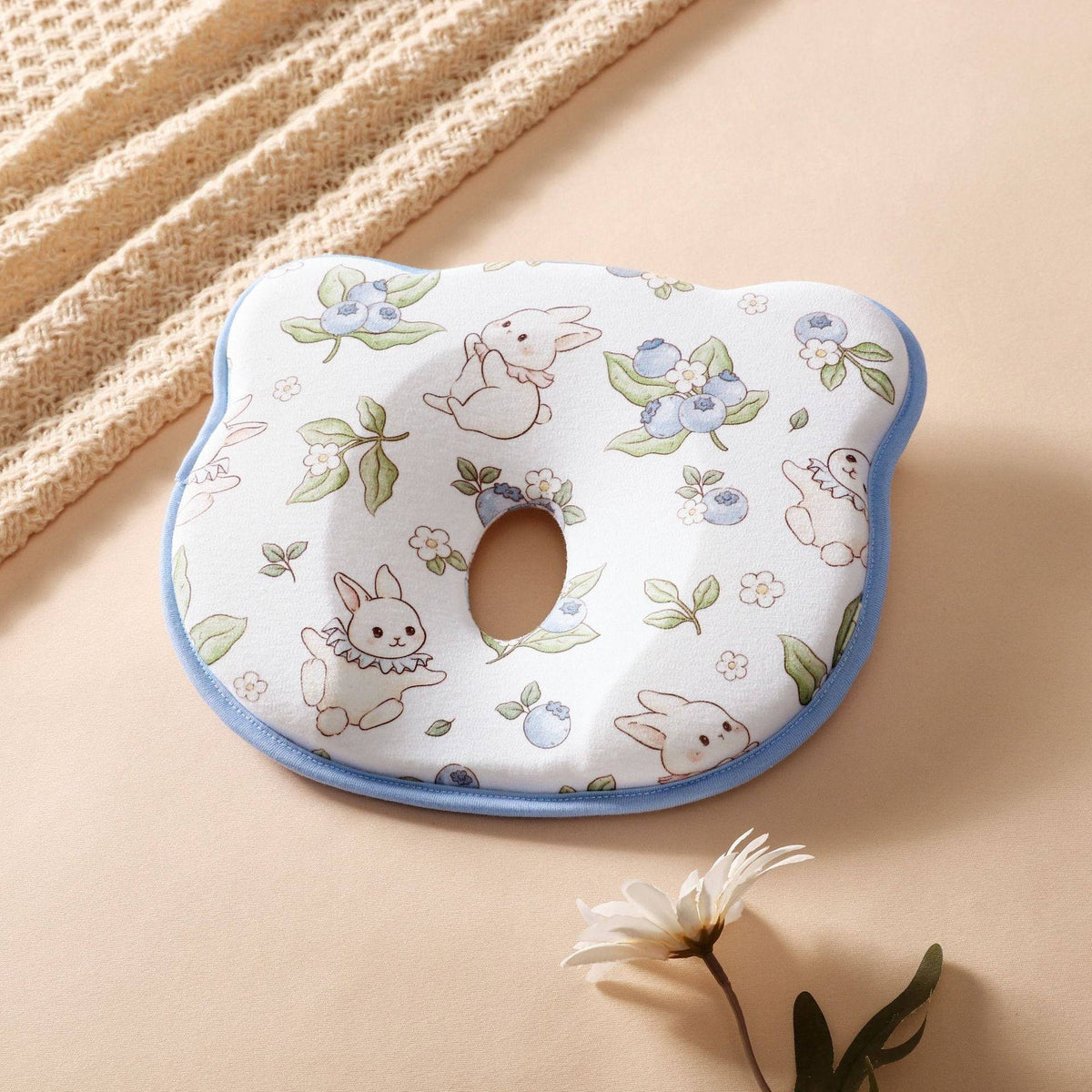 Belro infant pillow designed to prevent flat head, featuring sweat-absorbent material and ergonomic shape for baby comfort.