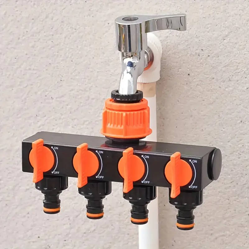 Belro 4-way garden hose splitter attached to a garden hose, showing multiple outlets for watering different garden areas.
