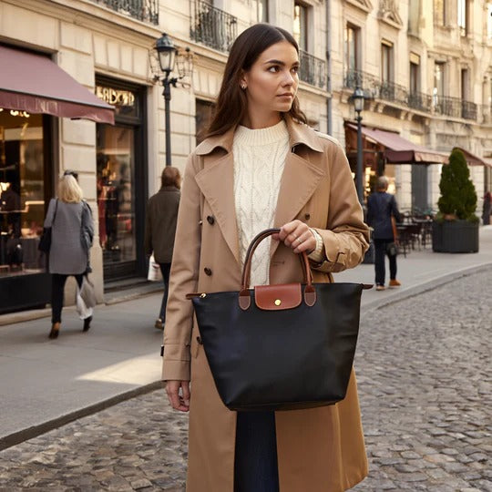 Belro women's handbag with sleek design, showcasing textured leather surface and compact shape for stylish accessory use.