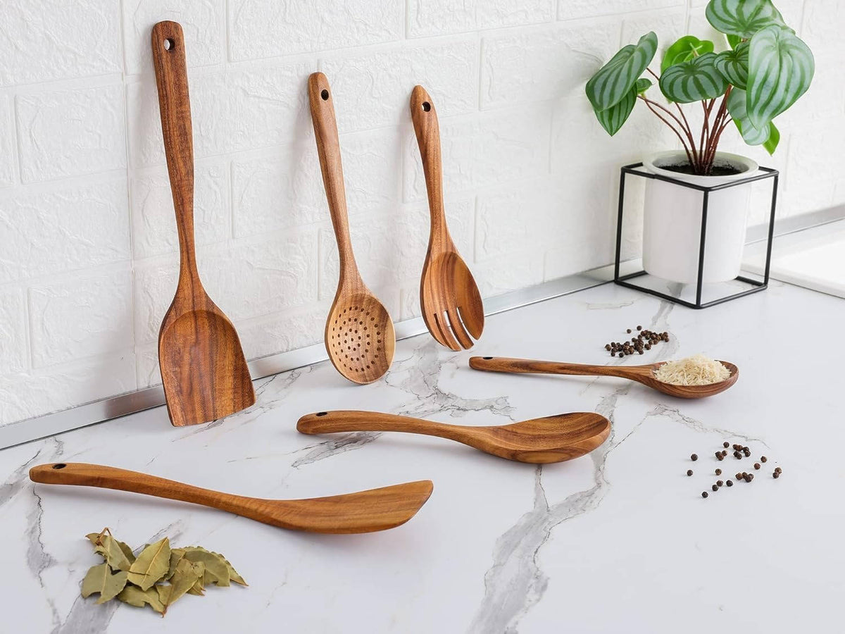 Set of 6 wooden kitchen utensils from Belro, including spoons and spatulas, displayed on a kitchen countertop.