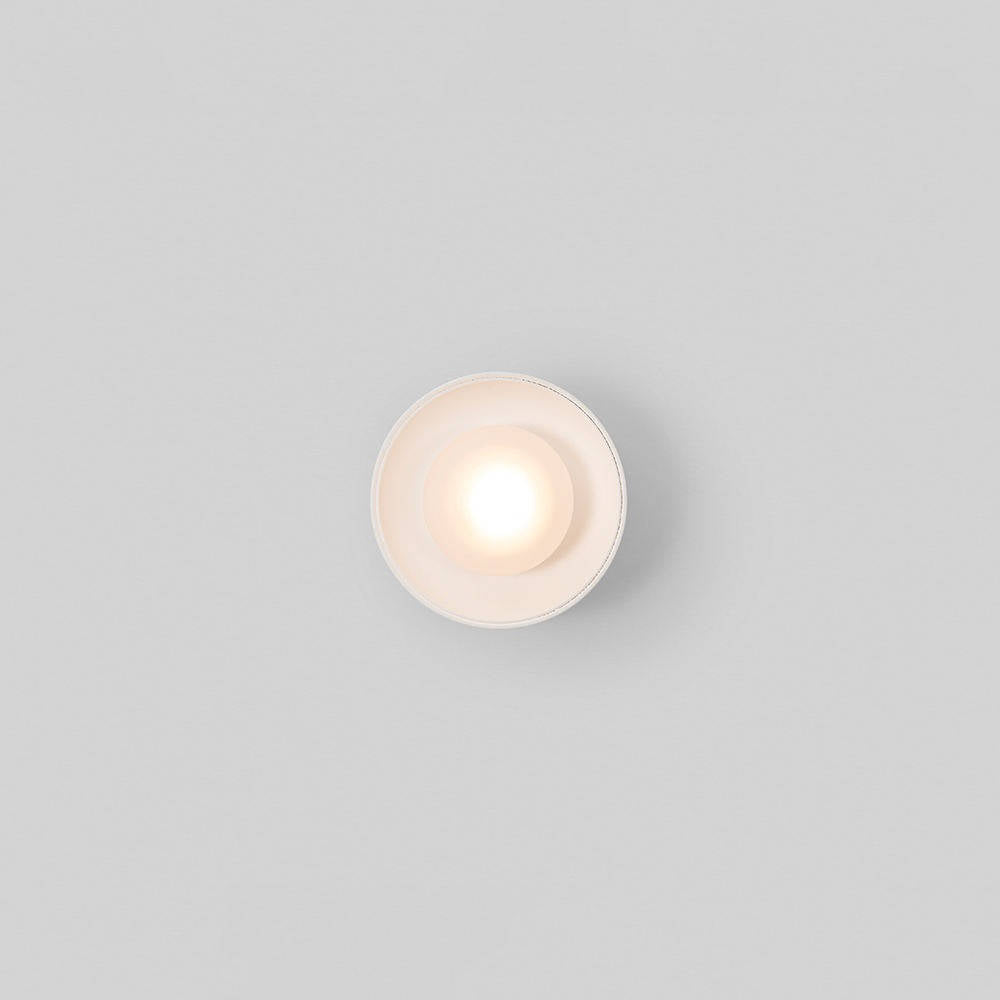Modern black Nordic wall lamp by Belro installed outdoors, designed for stylish outdoor lighting in home and garden settings.