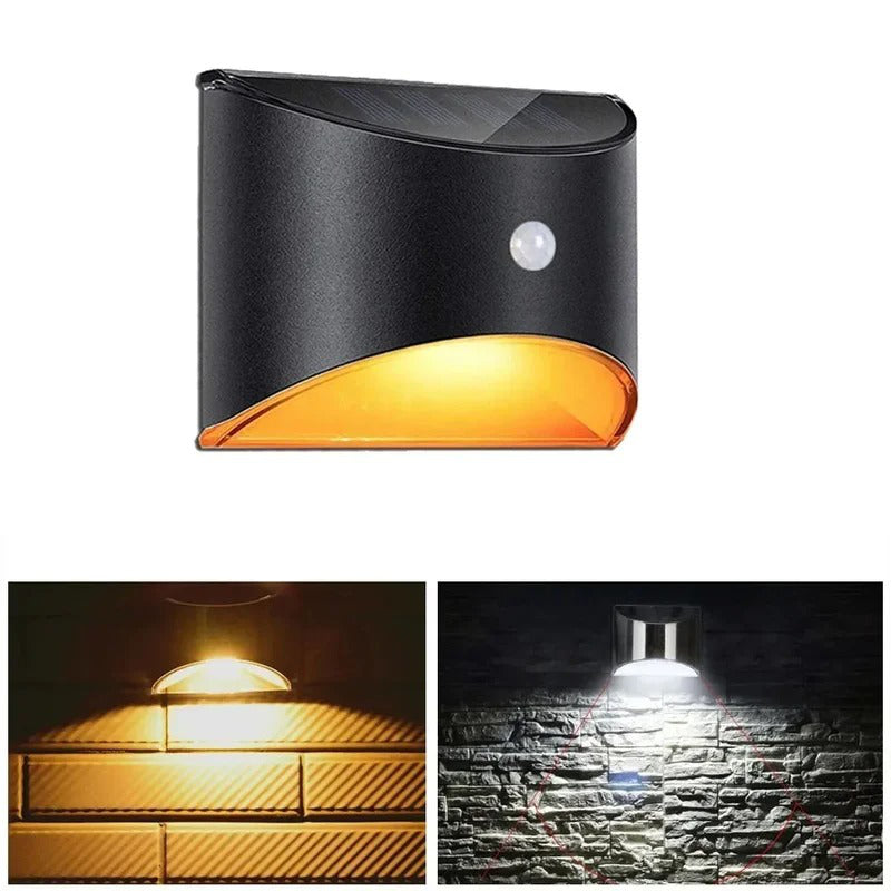 Belro outdoor fence stair light with motion sensor, illuminating a wooden fence and garden pathway at night.