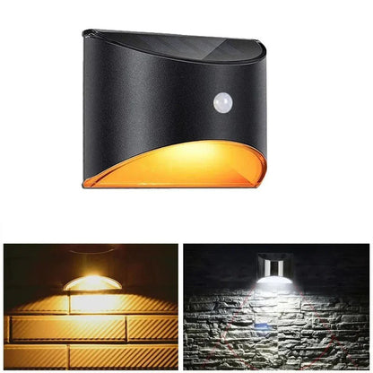 Belro outdoor fence stair light with motion sensor, illuminating a wooden fence and garden pathway at night.