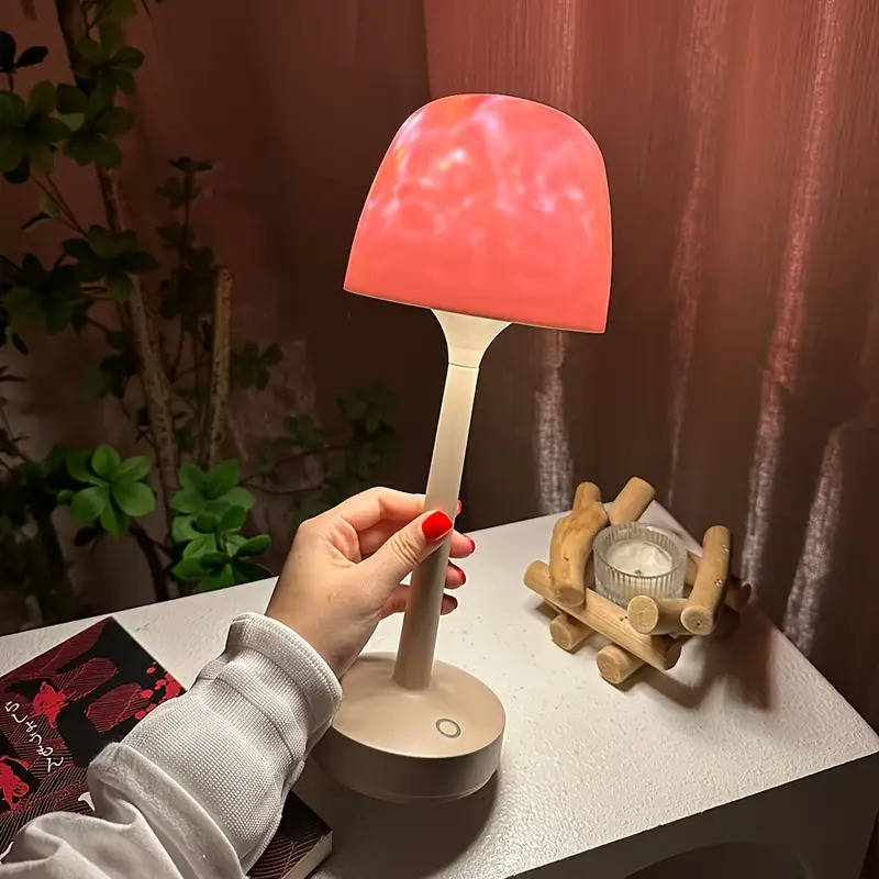 Belro cordless room light projector lamp illuminating a bedroom with star and moon projections on the wall.