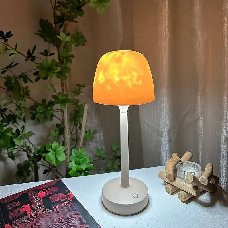 Belro cordless room light projector lamp displaying a starry night sky projection on a wall.