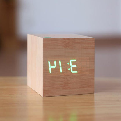 Modern digital wood clock by Belro, sleek design for home and garden desks, displays time on a natural wood finish.