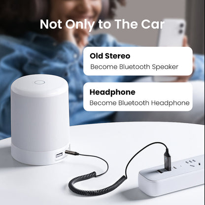 Belro Bluetooth Aux Adapter connected to audio device, compact electronic accessory for wireless audio streaming.