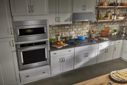 Casavibeo KitchenAid 30-inch 5-burner gas cooktop with stainless steel finish and control knobs visible on the surface.