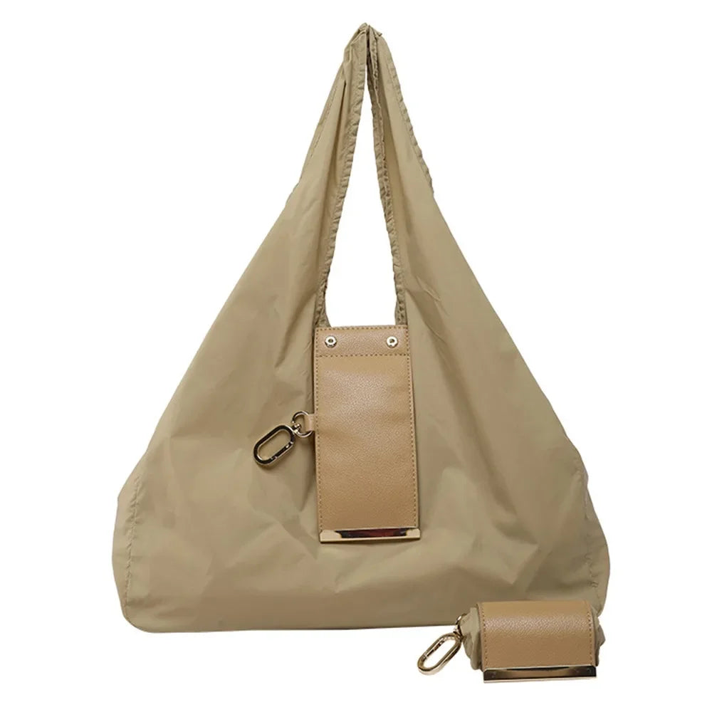 Khaki Belro mini foldable tote bag keychain accessory, compact and lightweight for on-the-go use, with a foldable design.