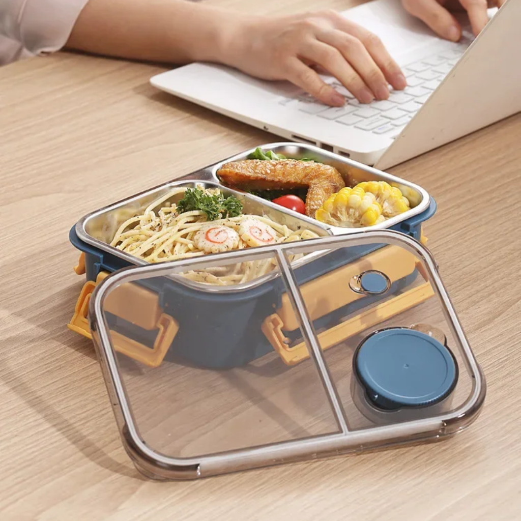Stainless steel Bento lunch box with multiple compartments and leakproof design, ideal for kitchen storage and meal packing.