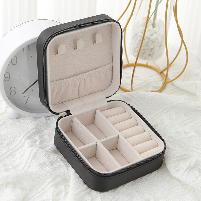Belro travel jewelry case with multiple compartments, compact design, and secure closure for organizing jewelry accessories.