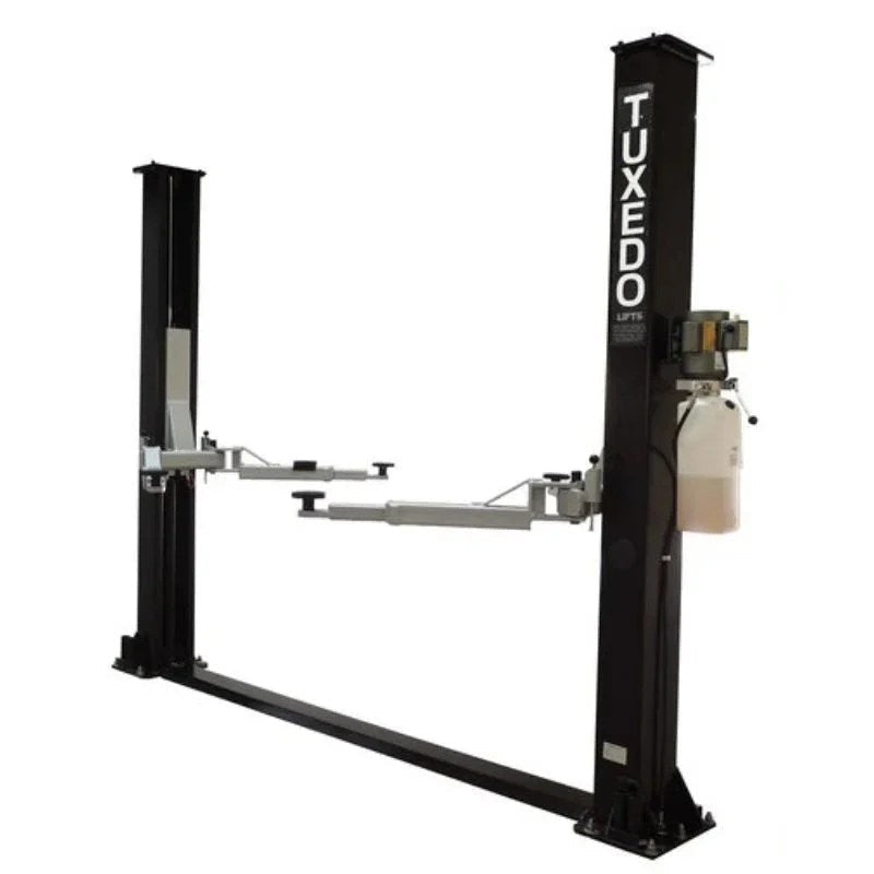 Casavibeo TP9KF TUX 9,000lb 2 Post Symmetric Car Lift showing the lift structure and platform in a workshop setting.