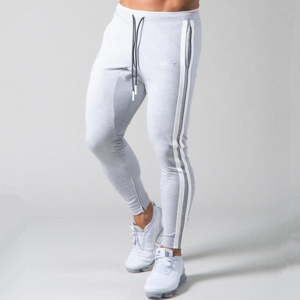 Belro slim-fit banded joggers in black, showing close-up of the comfortable elastic waistband and tapered pant fit.