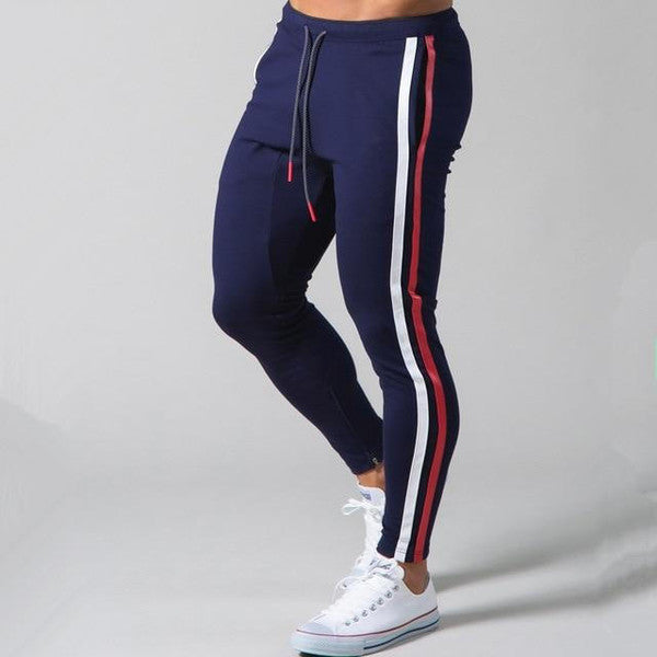 Belro slim-fit banded joggers in dark fabric showing a close-up of the waistband and tapered leg design.