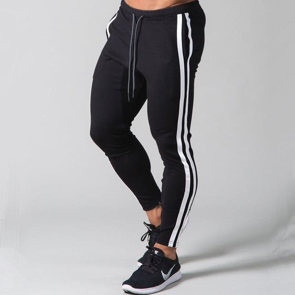 Belro slim-fit banded joggers in black fabric, showcasing the tapered leg and elastic waistband, casual athletic clothing.