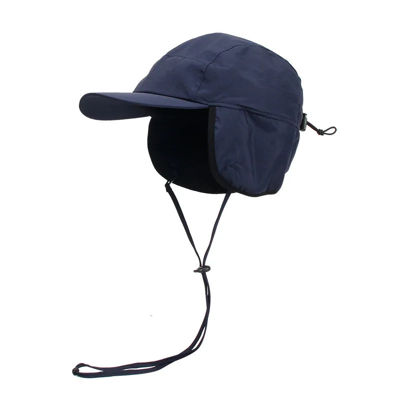 Navy blue winter bomber hat with ear flaps and chin straps, Belro brand, designed for cold weather and outdoor activities.