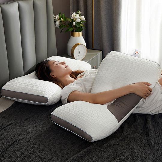 Belro hybrid pillow for back and side sleepers showing ergonomic design with neck and shoulder support in a neutral bedroom setting.