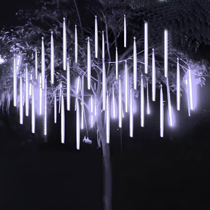 Belro Snowfall Garland Lights set of 8 outdoor holiday string lights hanging on a garden fence.