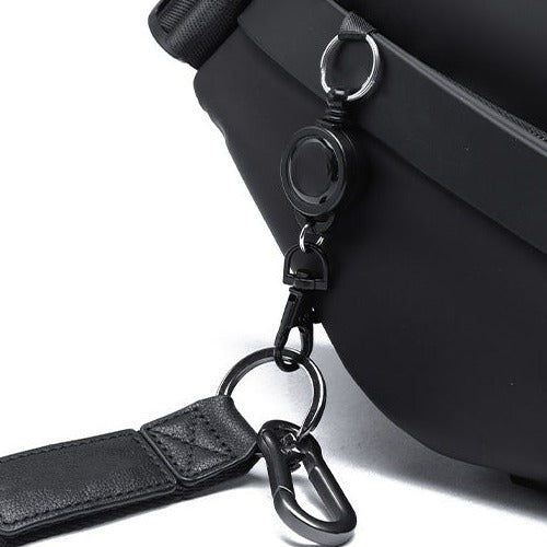 Belro sling bag for men in obsidian black, designed for electronics and camera storage, with adjustable strap and compact style.