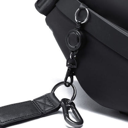 Belro sling bag for men in obsidian black, designed for electronics and camera storage, with adjustable strap and compact style.