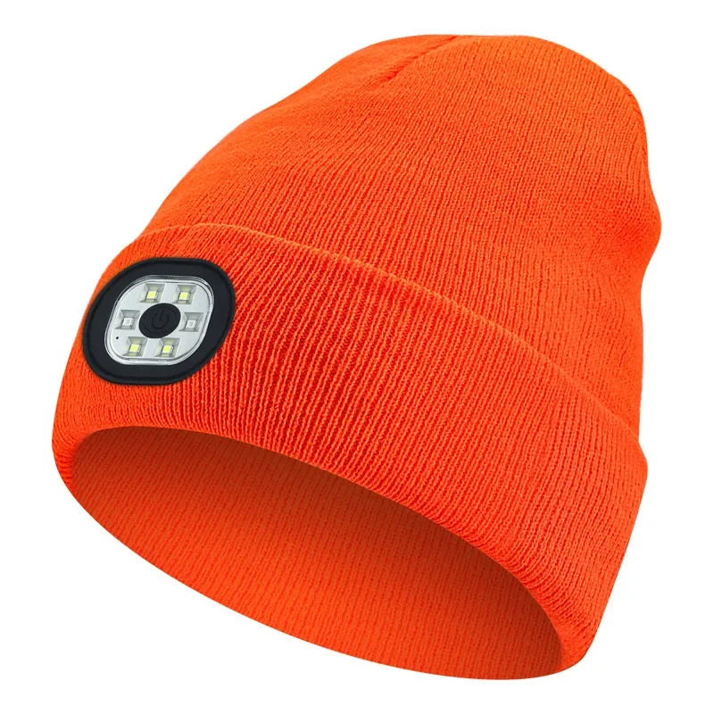 Orange Belro rechargeable LED beanie hat with built-in flashlight for winter warmth and hands-free lighting.