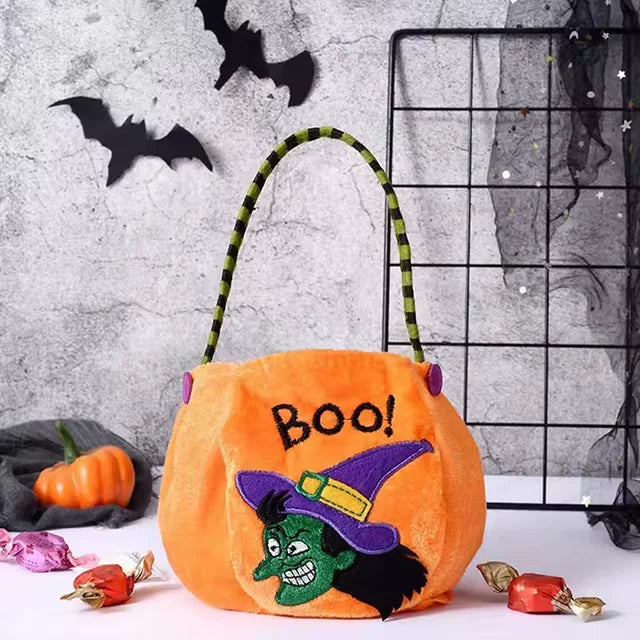 Orange pumpkin Halloween treat bag for kids by Belro, featuring a festive design for storing candies and treats.